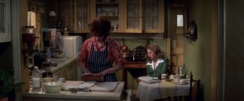 Movie still from “The Way We Were” (1973), directed by Sydney Pollack – Two women in a kitchen preparing a meal; Medium shot, High angle