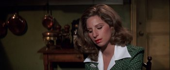 Movie still from “The Way We Were” (1973), directed by Sydney Pollack – A person wearing a green and white shirt; Close Up shot, High angle