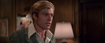 Movie still from “The Way We Were” (1973), directed by Sydney Pollack – A person wearing a shirt; Close Up shot, Over the shoulder angle