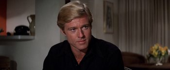 Movie still from “The Way We Were” (1973), directed by Sydney Pollack – A person wearing a black shirt; Close Up shot, Over the shoulder angle