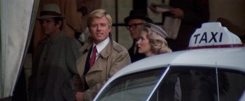 Movie still from “The Way We Were” (1973), directed by Sydney Pollack – A man and a woman standing next to each other; Close Up shot, Over the shoulder angle