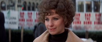 Movie still from “The Way We Were” (1973), directed by Sydney Pollack – A person wearing a coat; Close Up shot, High angle