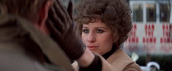Movie still from “The Way We Were” (1973), directed by Sydney Pollack – A person wearing a glove; Close Up shot, Over the shoulder angle