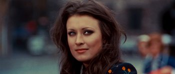 Movie still from “The Way of the Dragon” (1972), directed by Bruce Lee – A person with long brown hair; Close Up shot, Low angle