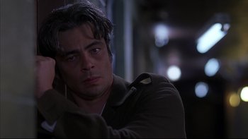 Movie still from “The Way of the Gun” (2000), directed by Christopher McQuarrie – A person wearing a jacket; Close Up shot, Low angle