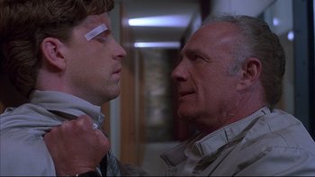 Movie still from “The Way of the Gun” (2000), directed by Christopher McQuarrie – A man and a woman looking at one another; Close Up shot, Over the shoulder angle