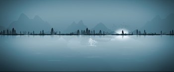 Movie still from “The Wedding Guest” (2018), directed by Michael Winterbottom – A large body of water in front of mountains; Extreme Wide shot, High angle