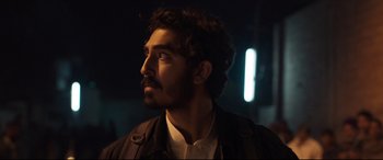 Movie still from “The Wedding Guest” (2018), directed by Michael Winterbottom – A person with a beard; Close Up shot, Low angle