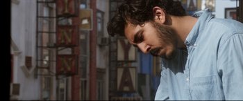 Movie still from “The Wedding Guest” (2018), directed by Michael Winterbottom – A person with a beard; Close Up shot, Low angle