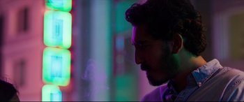 Movie still from “The Wedding Guest” (2018), directed by Michael Winterbottom – A person smoking a cigarette; Close Up shot, Low angle