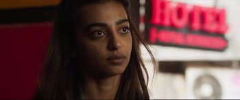 Movie still from “The Wedding Guest” (2018), directed by Michael Winterbottom – A person with long hair; Close Up shot, Over the shoulder angle