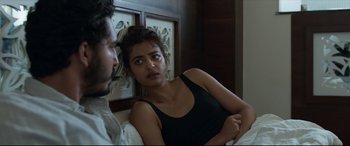 Movie still from “The Wedding Guest” (2018), directed by Michael Winterbottom – A man and a woman sitting on a bed; Close Up shot, Over the shoulder angle