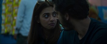 Movie still from “The Wedding Guest” (2018), directed by Michael Winterbottom – A man and a woman face each other; Close Up shot, Over the shoulder angle