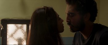 Movie still from “The Wedding Guest” (2018), directed by Michael Winterbottom – A man and a woman face to face in a room; Close Up shot, Over the shoulder angle