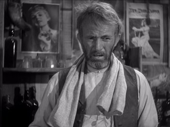 Movie still from “The Westerner” (1940), directed by William Wyler – An old man with a beard and a scarf around his neck; Close Up shot, Low angle