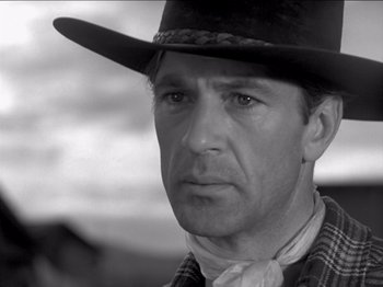 Movie still from “The Westerner” (1940), directed by William Wyler – Black and white photograph of a man wearing a cowboy hat; Close Up shot, Low angle