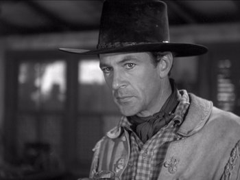 Movie still from “The Westerner” (1940), directed by William Wyler – Black and white photograph of a man wearing a cowboy hat; Close Up shot, Low angle