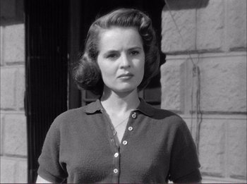 Movie still from “The Wild One” (1953), directed by Laslo Benedek – An old photo of a woman with a hair style; Close Up shot, Low angle