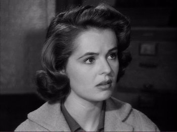 Movie still from “The Wild One” (1953), directed by Laslo Benedek – A black - and - white photo of a young woman; Close Up shot, High angle