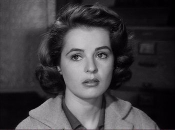 Movie still from “The Wild One” (1953), directed by Laslo Benedek – An old photo of an older woman with big hair; Close Up shot, High angle