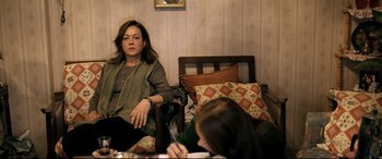 Movie still from “The Wild Pear Tree” (2018), directed by Nuri Bilge Ceylan – A woman sitting next to another woman on a bed; Medium shot, Over the shoulder angle