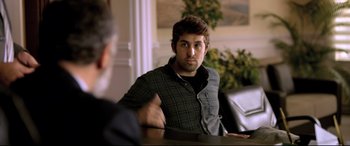 Movie still from “The Wild Pear Tree” (2018), directed by Nuri Bilge Ceylan – A man sitting in front of another man in front of a mirror; Medium shot, Over the shoulder angle