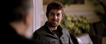 Movie still from “The Wild Pear Tree” (2018), directed by Nuri Bilge Ceylan – A person wearing a plaid shirt; Close Up shot, Over the shoulder angle