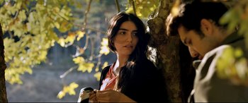 Movie still from “The Wild Pear Tree” (2018), directed by Nuri Bilge Ceylan – A beautiful young lady standing next to a tree; Close Up shot, Over the shoulder angle
