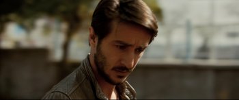 Movie still from “The Wild Pear Tree” (2018), directed by Nuri Bilge Ceylan – A person wearing a jacket; Close Up shot, Over the shoulder angle