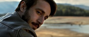 Movie still from “The Wild Pear Tree” (2018), directed by Nuri Bilge Ceylan – A person with a beard; Close Up shot, Over the shoulder angle
