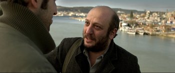 Movie still from “The Wild Pear Tree” (2018), directed by Nuri Bilge Ceylan – A person talking to another person; Close Up shot, Over the shoulder angle