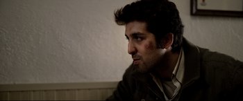 Movie still from “The Wild Pear Tree” (2018), directed by Nuri Bilge Ceylan – A person with a bruise on his face; Close Up shot, Over the shoulder angle