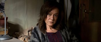 Movie still from “The Wild Pear Tree” (2018), directed by Nuri Bilge Ceylan – A person wearing a sweater; Close Up shot, High angle