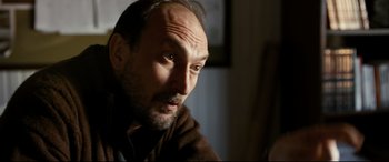 Movie still from “The Wild Pear Tree” (2018), directed by Nuri Bilge Ceylan – A person looking at the camera; Close Up shot, Low angle