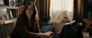Movie still from “The Wild Pear Tree” (2018), directed by Nuri Bilge Ceylan – A woman sitting on a chair in front of a window; Medium shot, Over the shoulder angle