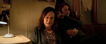 Movie still from “The Wild Pear Tree” (2018), directed by Nuri Bilge Ceylan – A woman sitting in front of a mirror talking on the phone; Medium shot, Over the shoulder angle