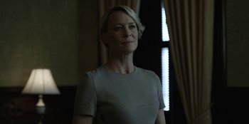 Movie still from “House of Cards” (2013), created by Beau Willimon – A person standing in a room near a window; Close Up shot, Low angle