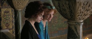 Movie still from “The Wings of the Dove” (1997), directed by Iain Softley – A couple of women standing next to each other; Close Up shot, High angle