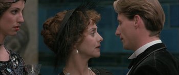 Movie still from “The Wings of the Dove” (1997), directed by Iain Softley – A man and a woman looking at one another; Close Up shot, Over the shoulder angle