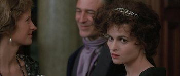 Movie still from “The Wings of the Dove” (1997), directed by Iain Softley – A man and a woman standing next to each other; Close Up shot, Over the shoulder angle