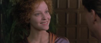 Movie still from “The Wings of the Dove” (1997), directed by Iain Softley – A person with curly red hair; Close Up shot, Low angle