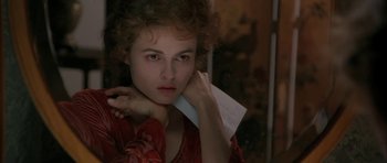 Movie still from “The Wings of the Dove” (1997), directed by Iain Softley – A woman holding a piece of paper in her hands; Close Up shot, High angle