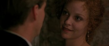 Movie still from “The Wings of the Dove” (1997), directed by Iain Softley – A woman looking into a mirror while standing next to a man; Close Up shot, Over the shoulder angle