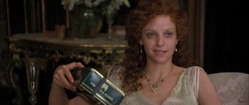 Movie still from “The Wings of the Dove” (1997), directed by Iain Softley – A woman holding a box in her hands; Close Up shot, High angle