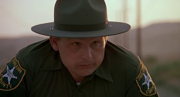 Movie still from “The Wizard” (1989), directed by Todd Holland – A person wearing a uniform and a hat; Close Up shot, Low angle