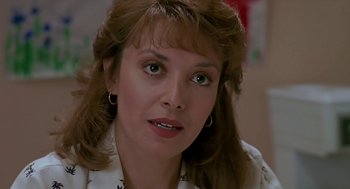 Movie still from “The Wizard” (1989), directed by Todd Holland – A person wearing a white shirt; Close Up shot, Over the shoulder angle