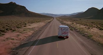 Movie still from “The Wizard” (1989), directed by Todd Holland – A van driving down the middle of a road; Extreme Wide shot, Low angle