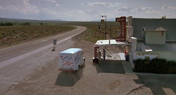 Movie still from “The Wizard” (1989), directed by Todd Holland – An ice cream truck is parked on the side of the road; Extreme Wide shot, High angle