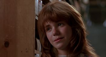 Movie still from “The Wizard” (1989), directed by Todd Holland – A young girl with long red hair looking at the camera; Close Up shot, Low angle