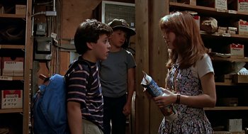 Movie still from “The Wizard” (1989), directed by Todd Holland – A group of people standing next to each other in a room; Medium shot, Over the shoulder angle